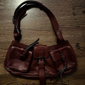 Women’s maroon Burberry bag